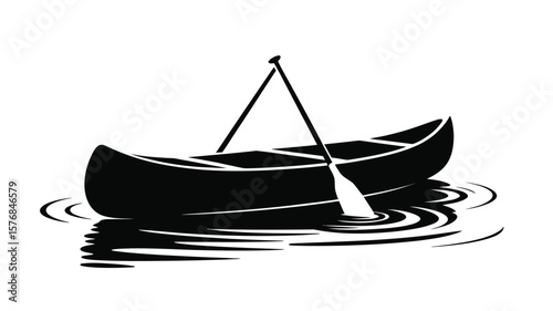 Black silhouette of a canoe with a paddle resting inside on rippling water