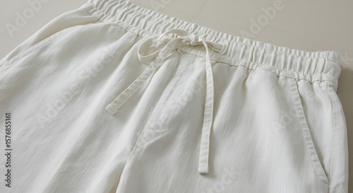 Wallpaper Mural Close-up of white linen pants with drawstring, showing texture and detail of the fabric Torontodigital.ca