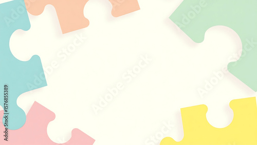 Colorful puzzle pieces partially assembled, creating a frame around the blank space.