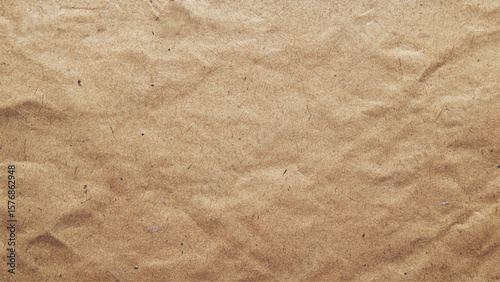 Bright cardboard material design wallpaper. Kraft paper texture. Brown cardboard background 