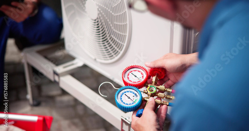 Commercial HVAC Worker Inspecting Air Conditioning System