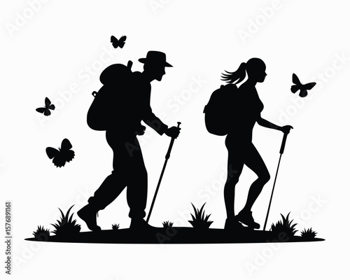 Silhouettes of two hikers exploring nature with backpacks and walking sticks among butterflies and grass.