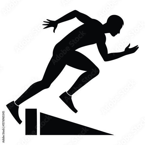 Silhouette of a sprinter in action approaching a hurdle during track and field competition