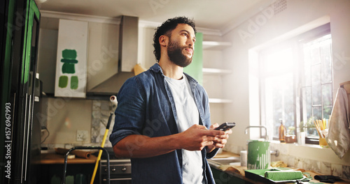 DIY, phone and thinking with man in kitchen of apartment to search for home improvement ideas. App, maintenance and renovation with homeowner in new house for interior design or online planning