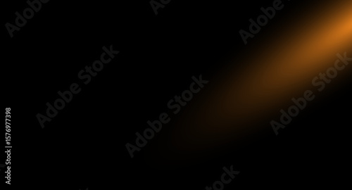 This image showcases a dynamic interplay of light and shadow, featuring a vibrant golden light source emanating from the upper-right corner, casting a warm glow against a deep black backdrop
