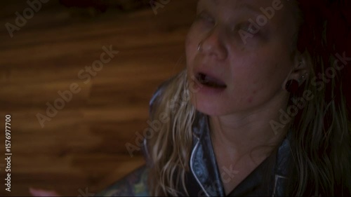 Woman possessed during seance, eyes roll white