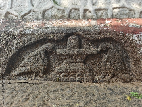 A spiritually resonant view of Thirukazhukundram, Tamil Nadu, India, capturing both the hilltop Vedagiriswarar Temple and the ancient foothill temple complex. The hill temple, dedicated to Lord Shiva,