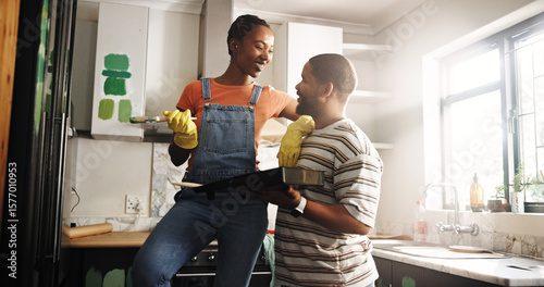Tableau sur toile Happy, couple and home improvement with paint in kitchen, talking and plan for renovation and decor