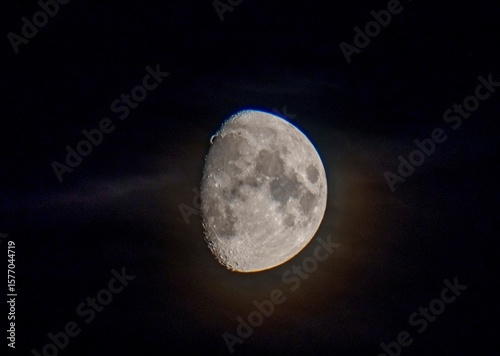 Vászonkép Waxing gibbous moon with soft clouds in night sky