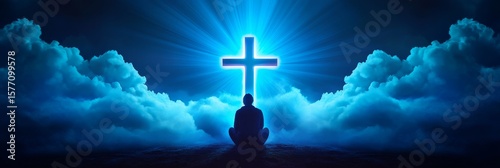 Peaceful Contemplation Under Celestial Cross - Silhouette of a person meditating before a glowing cross in a night sky filled with clouds. Spiritual, serene, hopeful