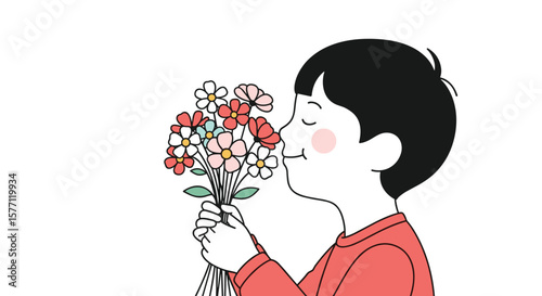 A happy child enjoys the delightful aroma of freshly picked flowers
