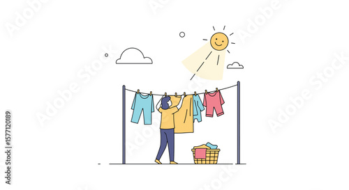 Man hangs laundry on clothesline outside on a sunny day with a basket nearby