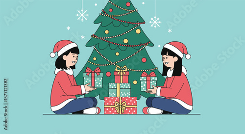 Two young girls in santa hats exchanging gifts by a decorated christmas tree