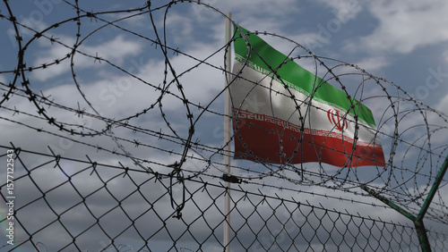 Iran waving flag with barbed wire fence