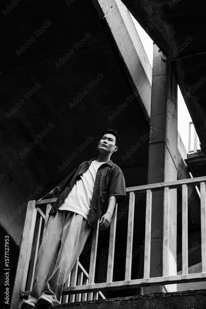 Naklejka premium Portrait of asian man in park on sports ground