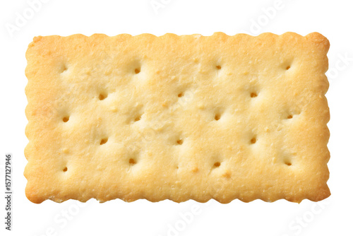 a cracker with holes on it on a white surface
