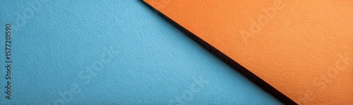 Minimalistic abstract background with blue and orange paper in close-up view, designed with clean layout and ample copy space for creative web banners, branding materials and digital presentations.