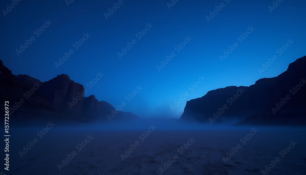 Fototapeta premium Tranquil Desert Night: Dark Blue Twilight Over Misty Sand and Silhouetted Rocks
