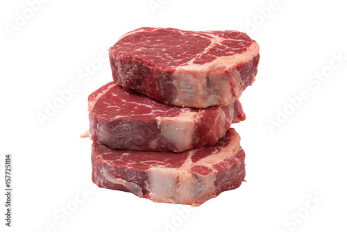 a stack of three pieces of meat on a white surface