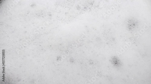 Soft and light white soap foam texture. Countless tiny bubbles create an attractive and soothing abstract pattern.