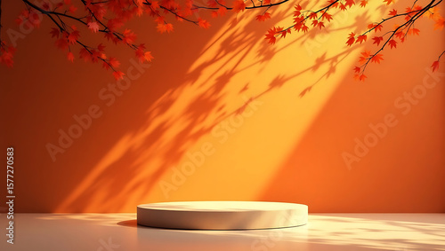 Autumnal scene with warm orange backdrop featuring a circular display podium and dappled sunlight casting leaf shadows from overhead branches
