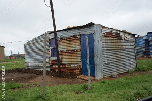 Blue painted shack in an informal settlement
