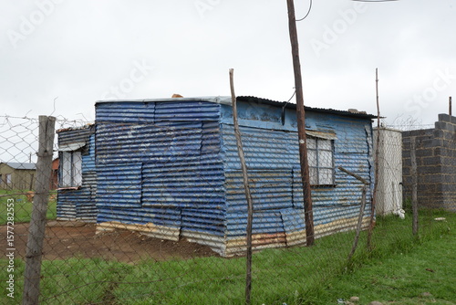 Blue painted shack in an informal settlement
