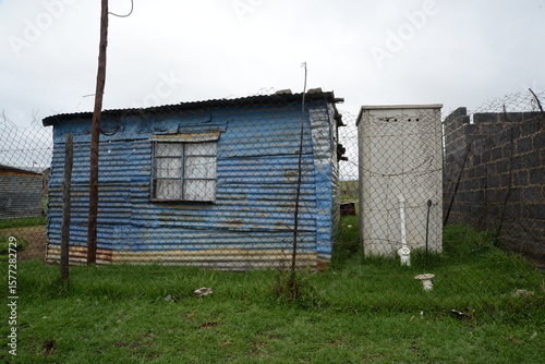 Blue painted shack in an informal settlement