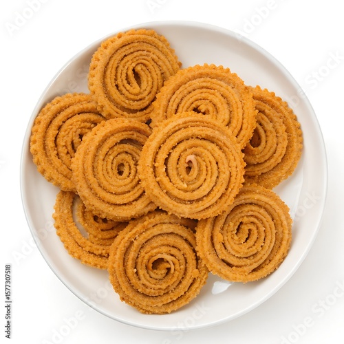 
Golden Murukku: A Delicious Indian Snack in a white plate top down view
