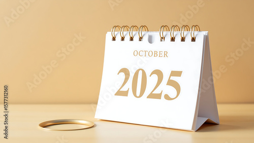2025, minimalist october calendar features bold bright numbers crisp white background set warm beige wooden table