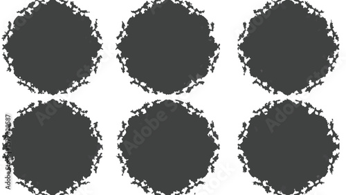 Abstract representation of dark irregular shapes against a white background creating a stark contrast look