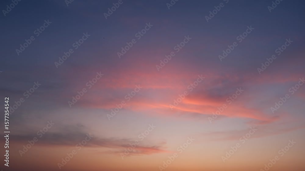 A tranquil sunrise sky timelapse with soft orange and pink clouds gently illuminated against a calm blue backdrop, evoking the peaceful start of a new day with warm, subtle hues. Time lapse.
A tranquil sunrise sky timelapse with soft orange and pink clouds gently illuminated against a calm blue backdrop, evoking the peaceful start of a new day with warm, subtle hues. Time lapse.