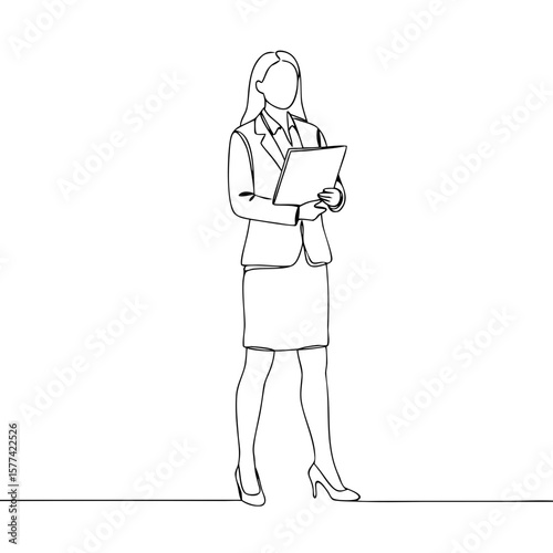 Businesswoman standing confidently while holding a clipboard in a suit  