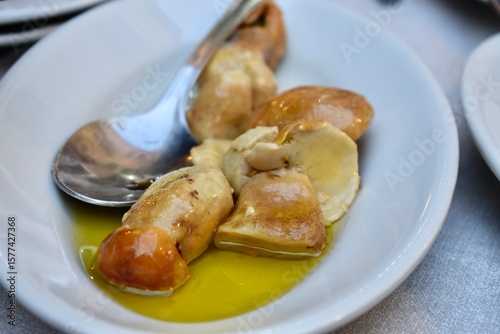 Typical starter with muhrooms in olive oil from Italy Maremma area