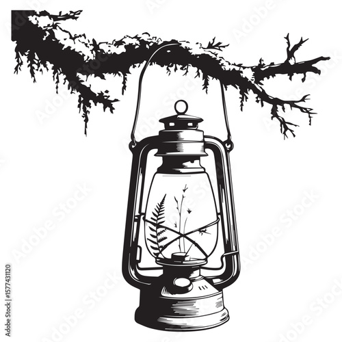 Vintage oil lantern with delicate fern and grass inside hanging from a silhouetted tree branch