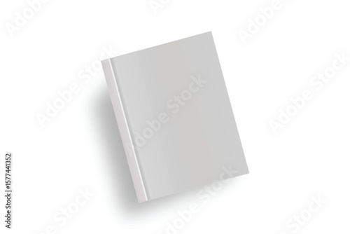 Book on a White Surface: A simple, elegantly styled book. The plain cover implies content ready to be filled or written on, offering space for imagination and ideas.