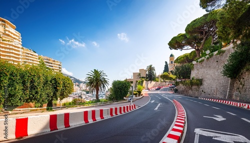 monte carlo street curve with formula one red and white signs in a sunny summer day in monte carlo monaco