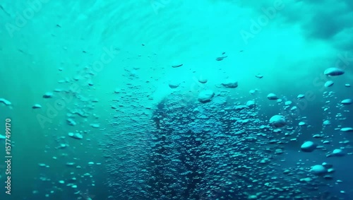 Underwater World: A vibrant view of an underwater world is shown, bubbles rise, adding life to the serene atmosphere of an ocean scene. Explore the ethereal depths.
