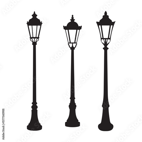 Three ornate vintage street lamps in silhouette lamppost