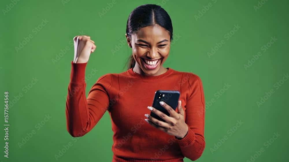 Woman celebrating success on smartphone Woman celebrating success on smartphone