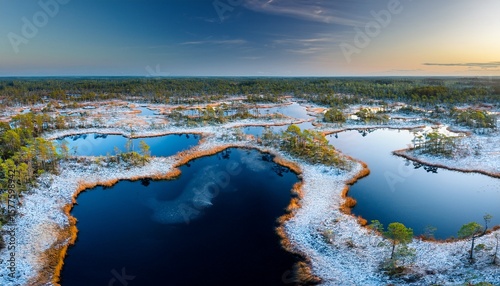 aerial view to the bog lakes with the first ice and night frost in kuresoo bog soomaa national park