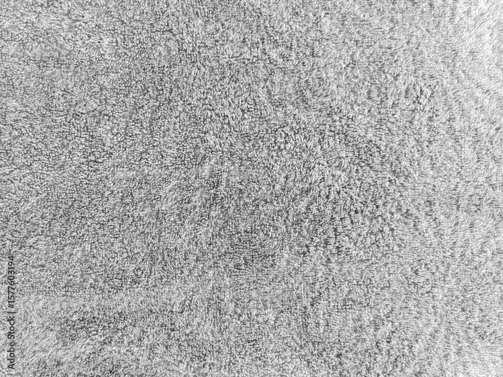 Fototapeta premium gray shower towel texture. Fluffy carpet background. Blank bathroom textile. Warm sweater natural material. Soft baby fabric backdrop detail. Grey flat surface. Home canvas design