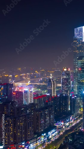 Wallpaper Mural flight over guangzhou city traffic riverside downtown night illumination aerial timelapse vertical panorama 4k china Torontodigital.ca