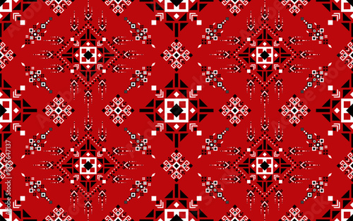 A symmetrical, intricate geometric pattern in red, black, and white featuring stars and diamond shapes, resembling traditional textile or mosaic art.
