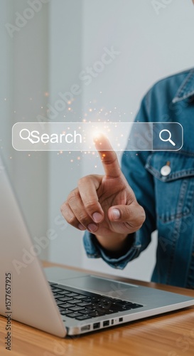 Modern search interface with person pointing at virtual bar. Digital technology concept with clean layout. User engaging with futuristic search function.