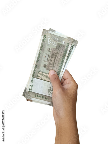 Hand holding a few ₹500 Indian currency notes, finances, economy, savings.