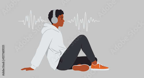 A young man with headphones is listening to music while sitting on the floor, surrounded by sound waves