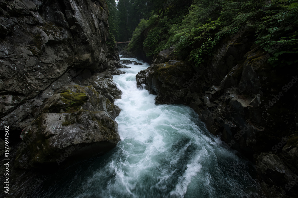 A roaring mountain river slices through a granite gorge A roaring mountain river slices through a granite gorge