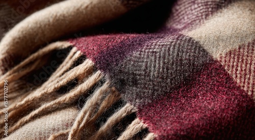 Soft, fringed plaid blanket with tan, beige, and red color blocks & woven texture