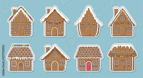 An assortment of whimsical gingerbread houses decorated with sweet frosting and candies on a light blue background